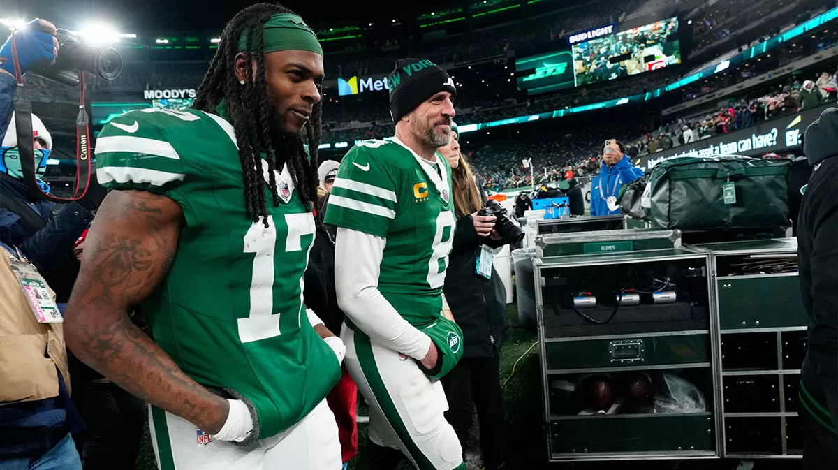 New York Jets wide receiver Davante Adams (17) and New York Jets quarterback Aaron Rodgers (8) are shown as they get ready to step off the field at MetLife Stadium, Sunday January 5, 2025, in East Rutherford.