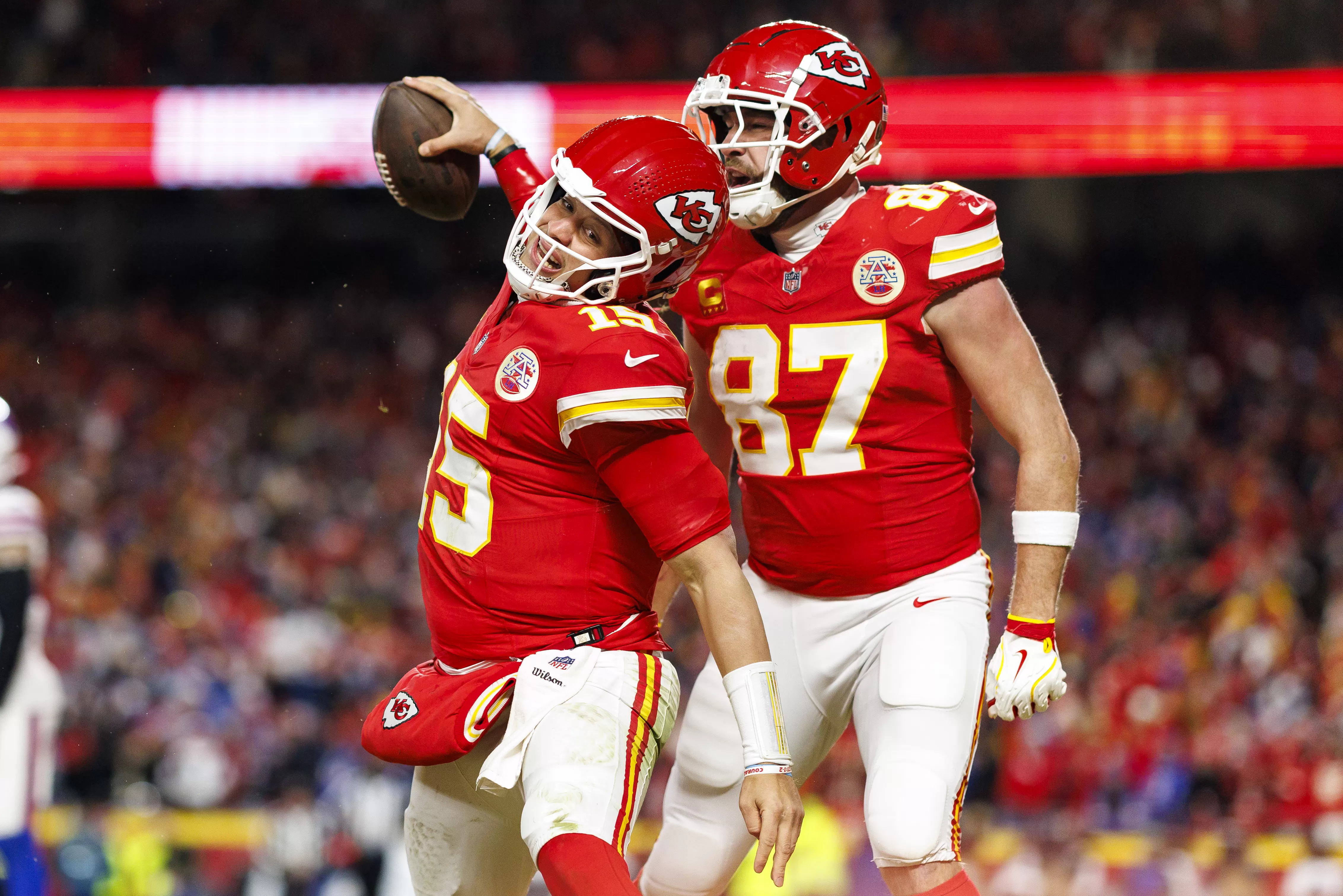 Patrick Mahomes #15 and Travis Kelce #87 of the Kansas City Chiefs celebrating a touchdown.