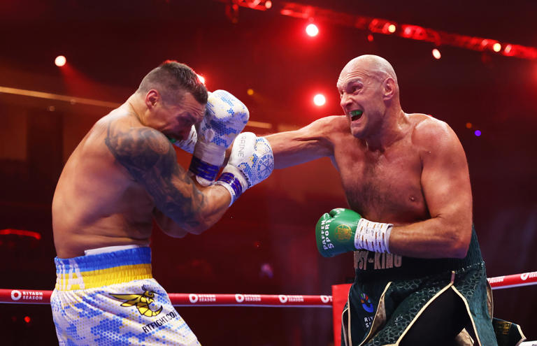 Tyson Fury punches Oleksandr Usyk during the IBF, WBA, WBC, WBO and Undisputed Heavyweight titles' fight between Tyson Fury and Oleksandr Usyk at Kingdom Arena on May 18, 2024 in Riyadh, Saudi Arabia. (Photo by Richard Pelham/Getty Images)