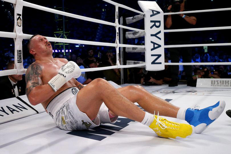 Oleksandr Usyk reacts after being knocked down by Daniel Dubois