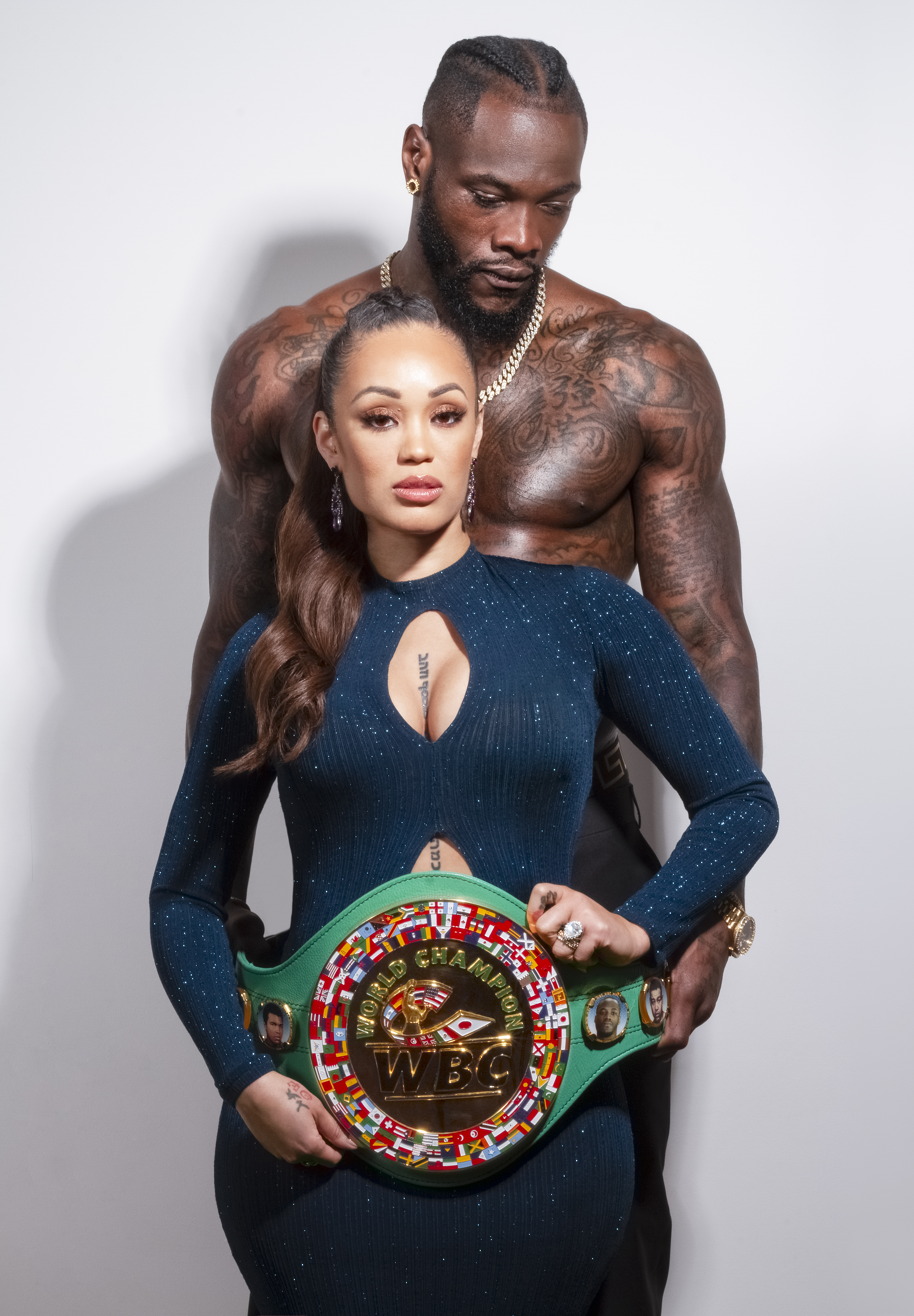 Swift pictured with Wilder and the WBC heavyweight title he used to hold