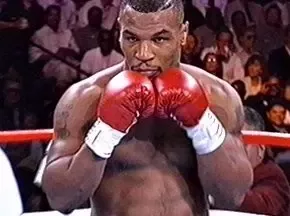 Why did Mike Tyson fight with his chest forward? - Quora