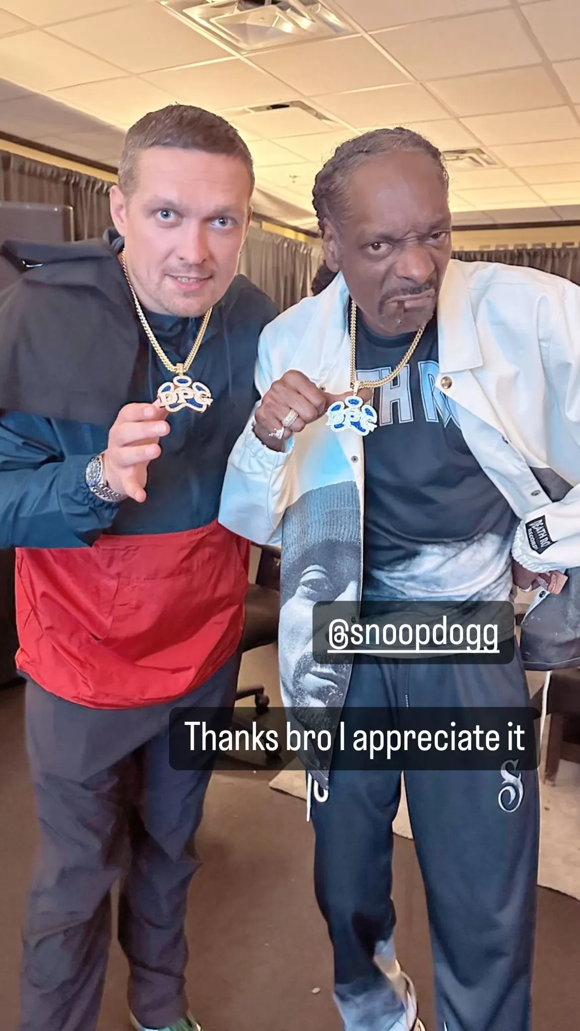 Usyk showed off his new matching bling alongside the rapper