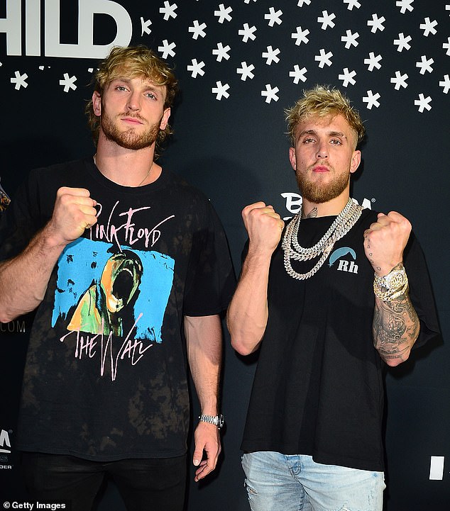 Logan Paul (L) has appeared to offer to replace Mike Tyson and fight his brother Jake Paul (R)