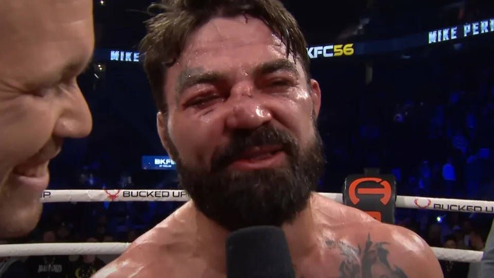 Mike Perry with a swollen face and a smile on the heels of his victory over Eddie Alvarez