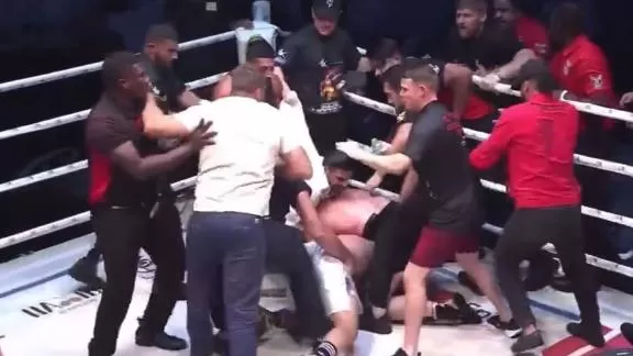 Darren Till's punch to back of head stops fight, ends in brawl in the ring