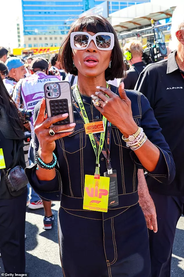 Naomi Campbell put on a pouty display as she walked on the grid during the F1 Grand Prix of Azerbaijan in double denim at Baku City Circuit on Sunday