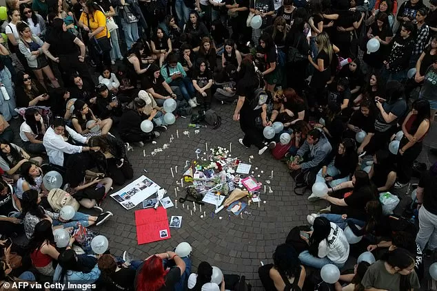 Fans light candles as they pay tribute to Liam Payne at the Obelisco in Buenos Aires last night