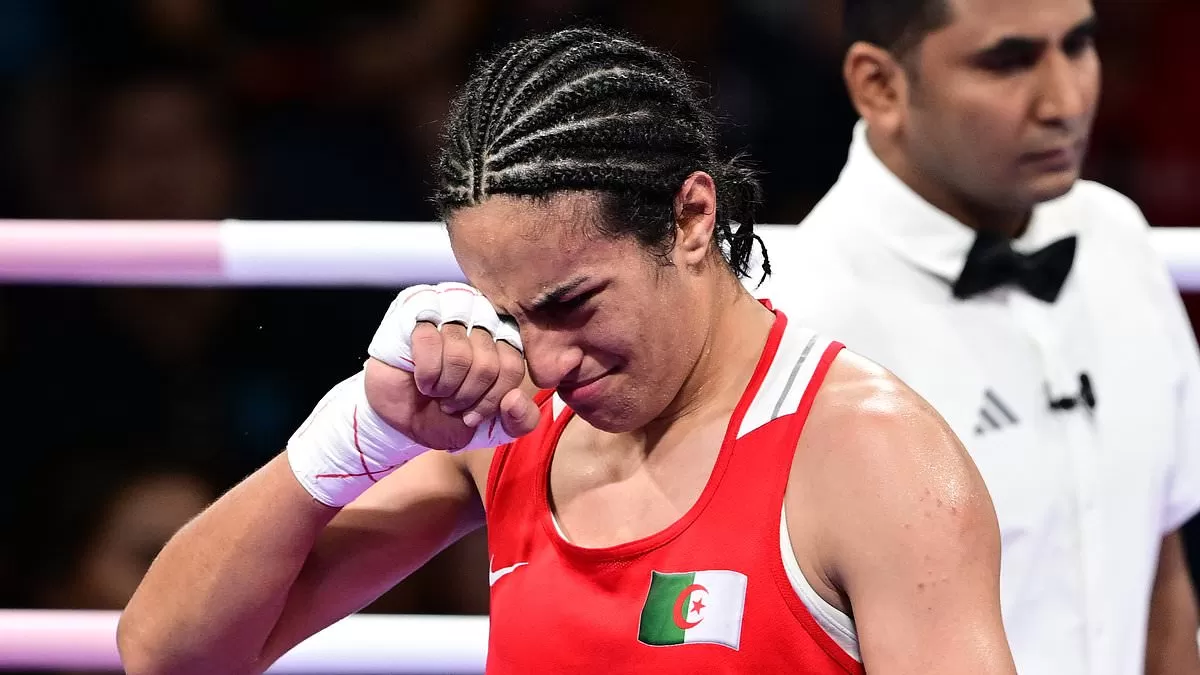 Olympics gender row boxer Imane Khelif bursts in tears and declares 'I am a  woman' - as she gloats about 'winning a medal for Algeria and Arabs' having  guaranteed at least a