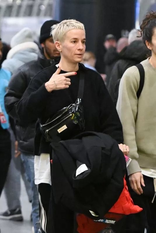 MEGAN RAPINOE and SUE BIRD Arrives at JFK Airport in New York 12/13/2023 –  HawtCelebs