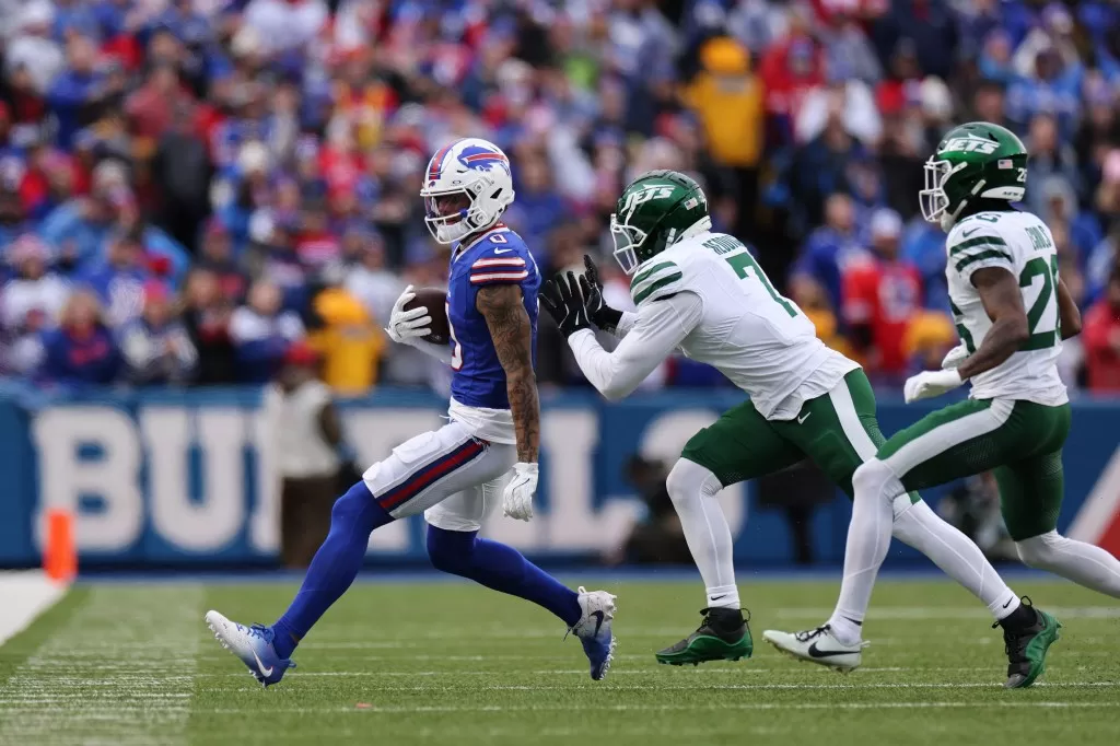 Haason Reddick pushes Bills wide receiver Keon Coleman out of bounds on Sunday.