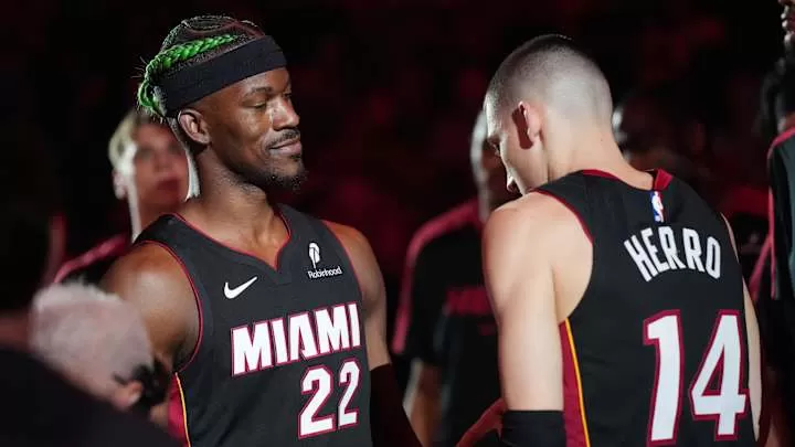Jan 2, 2025; Miami, Florida, USA;  Miami Heat forward Jimmy Butler (22) and guard Tyler Herro (14) are introduced during pregame ceremonies before the game against the Indiana Pacers at Kaseya Center. Mandatory Credit: Jim Rassol-Imagn Images