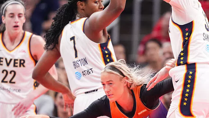 Phoenix Mercury guard Sophie Cunningham (9) rushes after the ball against Indiana Fever forward Aliyah Boston (7) and Indiana Fever forward Katie Lou Samuelson (33) on Friday, July 12, 2024, during the game at Gainbridge Fieldhouse in Indianapolis. The Indiana Fever defeated the Phoenix Mercury, 95-86.