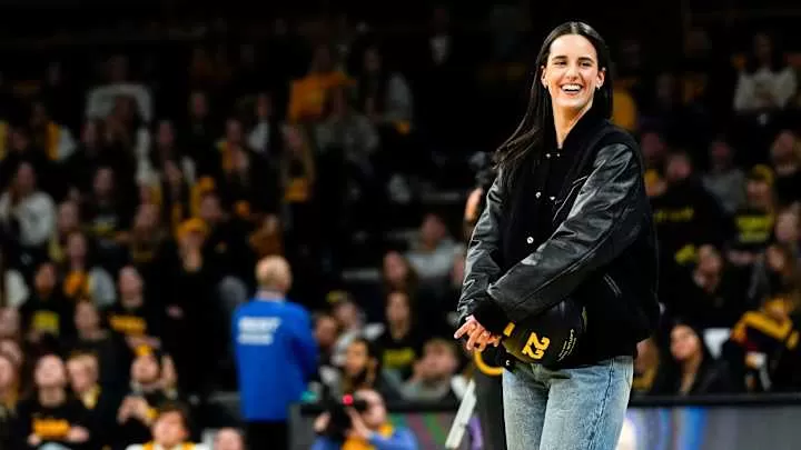 Caitlin Clark reacts during a video featuring clips submitted by fans during her jersey retirement ceremony Sunday, Feb. 2, 2025 at Carver-Hawkeye Arena in Iowa City, Iowa.