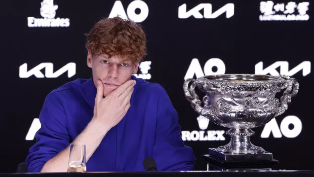 Men's singles champion Jannik Sinner attends a press conference.